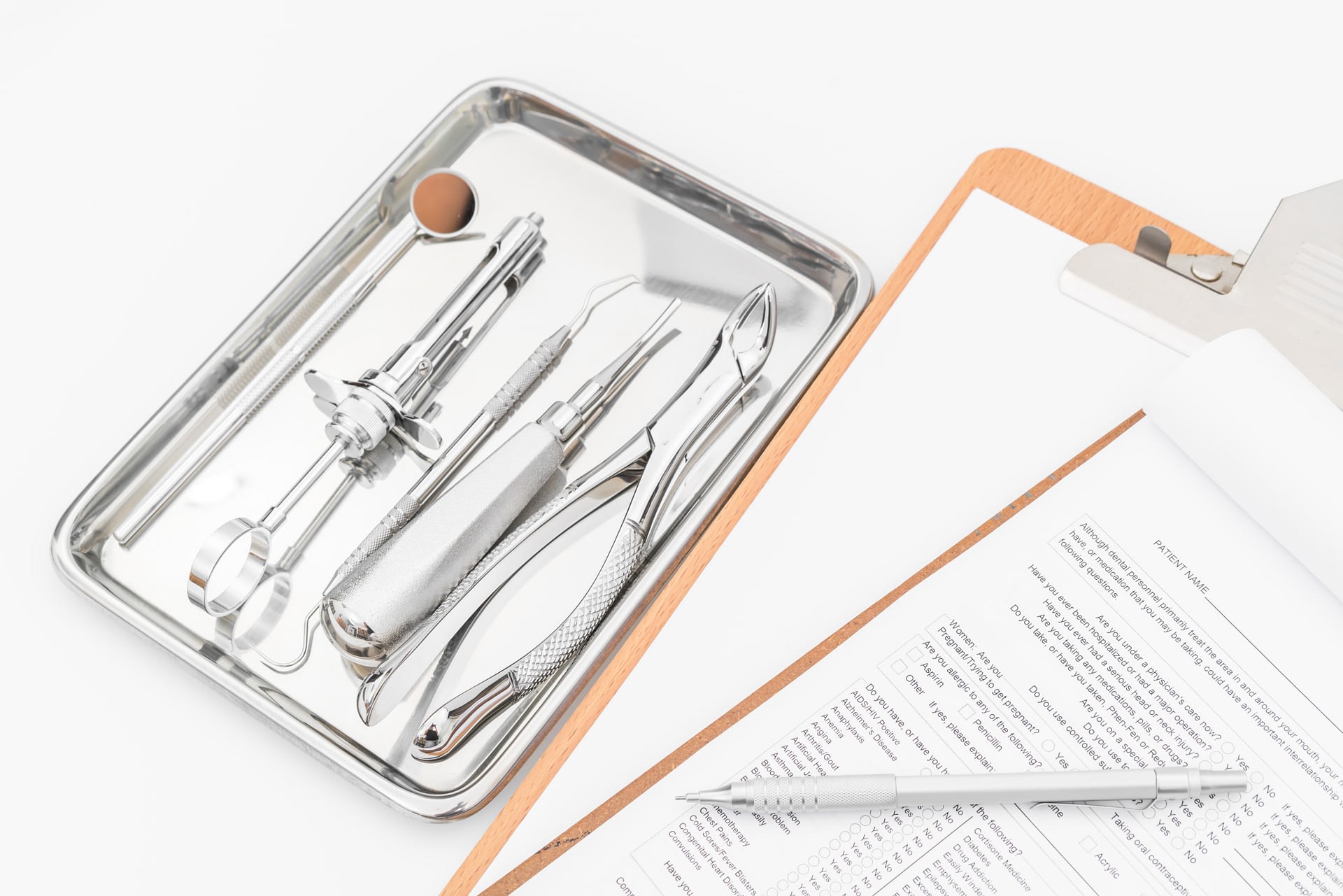 Dental tools, equipment and dental chart on white background.